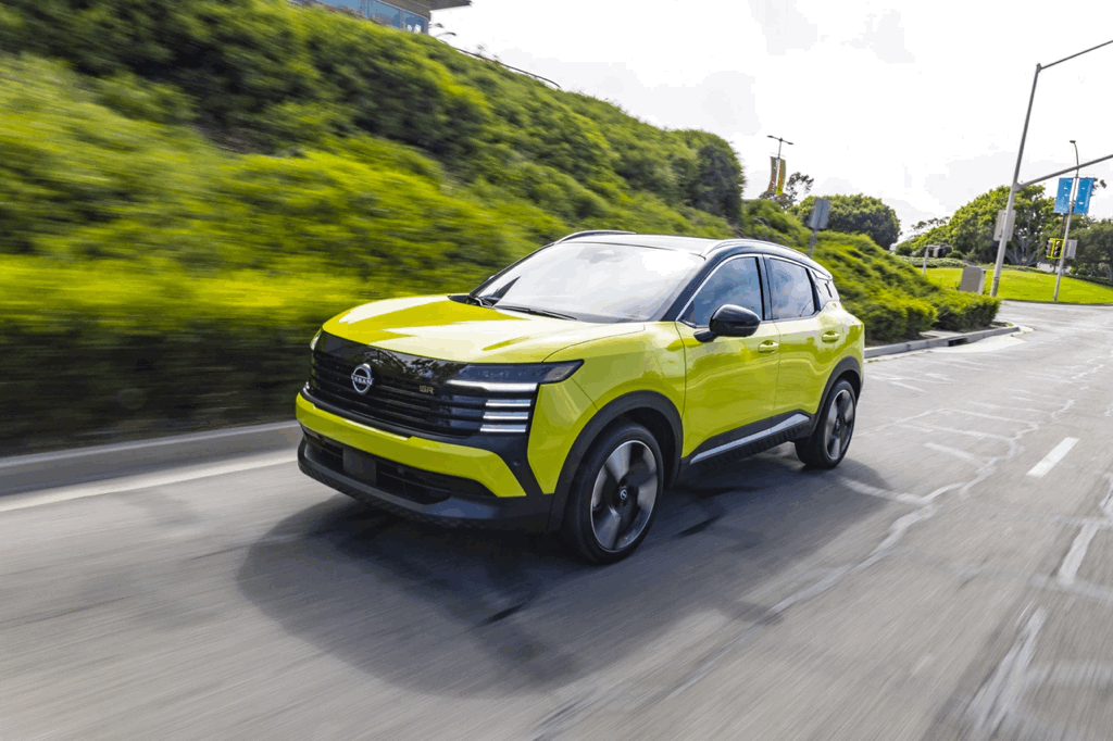 Yellow 2026 Nissan Kicks in motion, safety technologies and driver assistance.