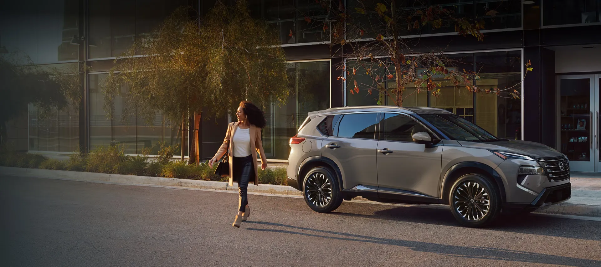 2026 Nissan Rogue parked in the city to present its price and specs.
