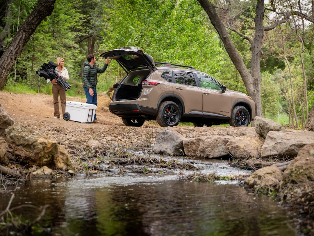 2026 Nissan Rogue with open liftgate to illustrate dimensions and cargo space.