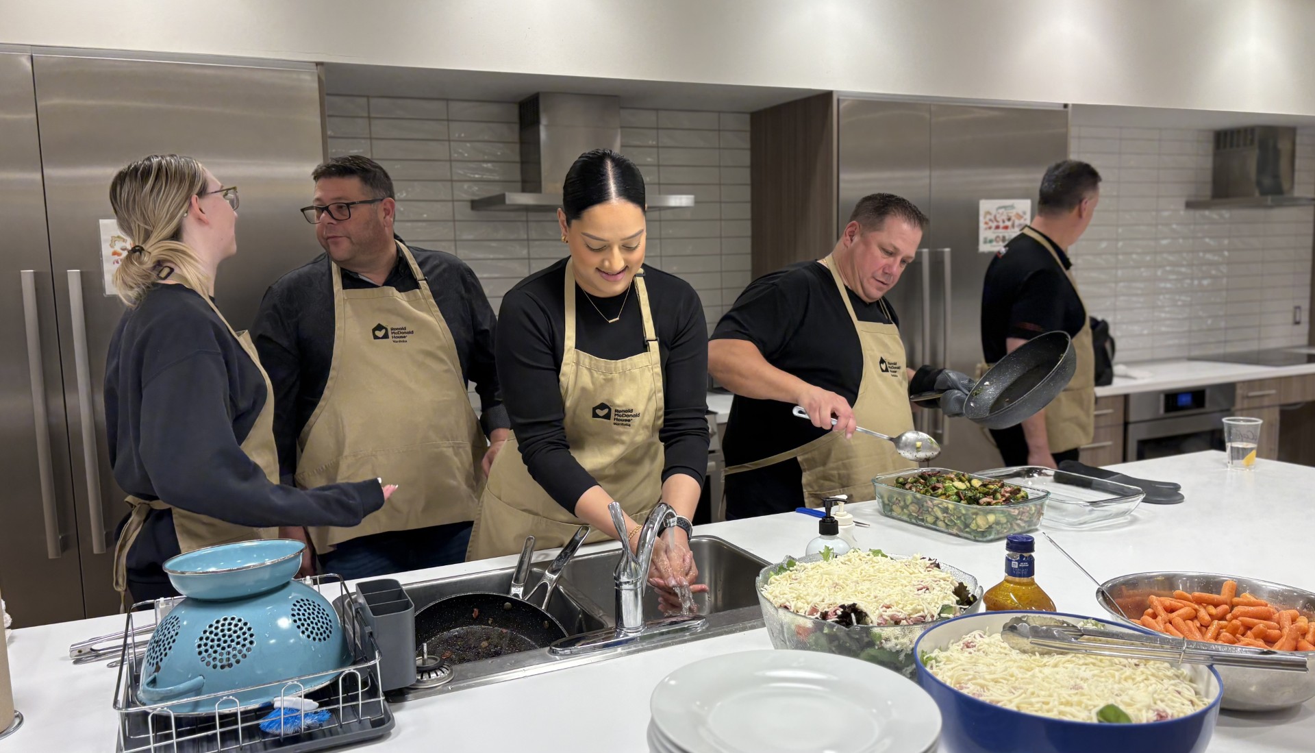 Vickar Nissan employees cooking dinner for families at Ronald McDonald House Manitoba