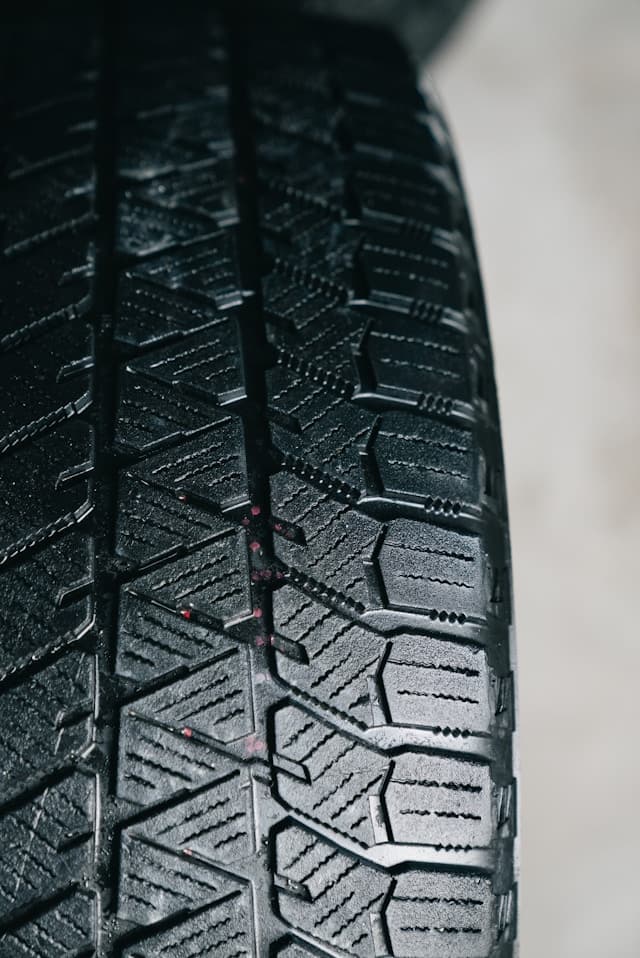 close up shot of a winter tire, showing the tread pattern